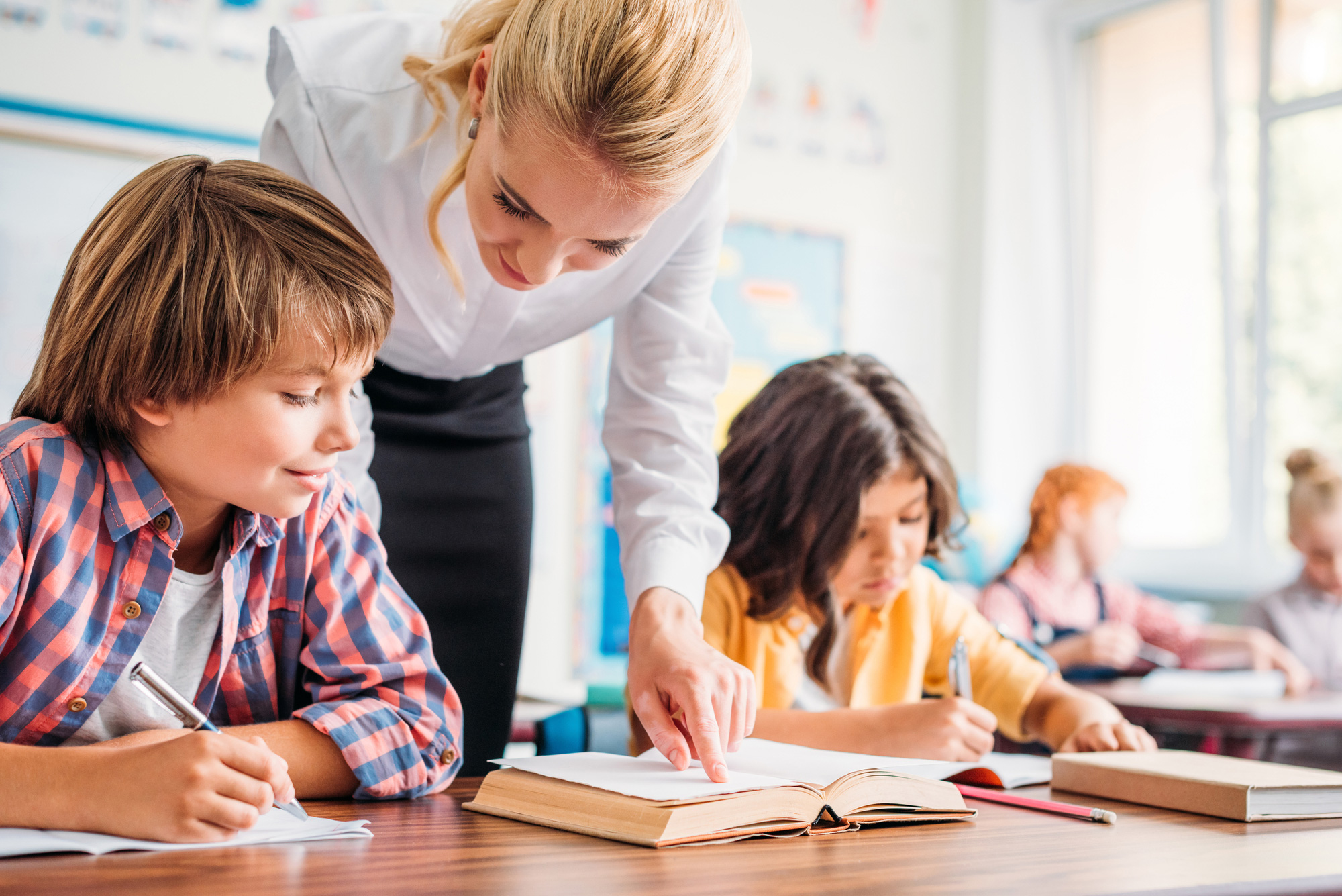 teacher and students with insurance that are Protecting Educators And Their Services