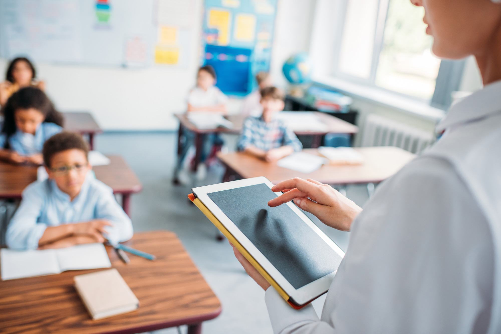 teacher using tablet with Technology Insurance